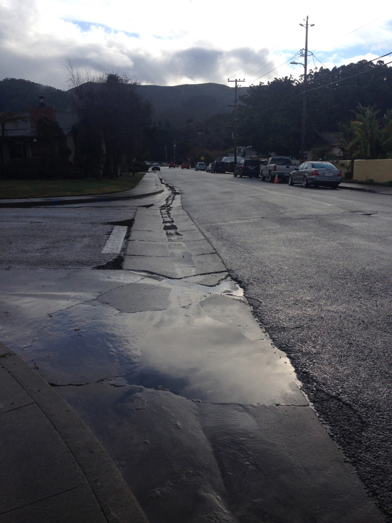 puddle rain soaked street pacifica ca